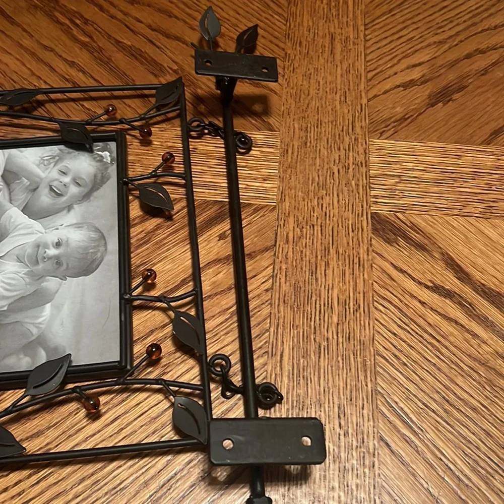 Brown wrought iron with brown bead hanging picture frames. No screws included